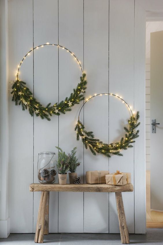 Simple and beautiful Christmas wreaths with lights, evergreens and white stars are great for Christmas