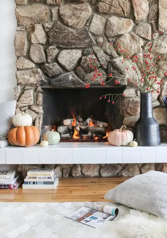 A beautiful natural stone clad fireplace looks cool, bold and textured and is sure to attract attention
