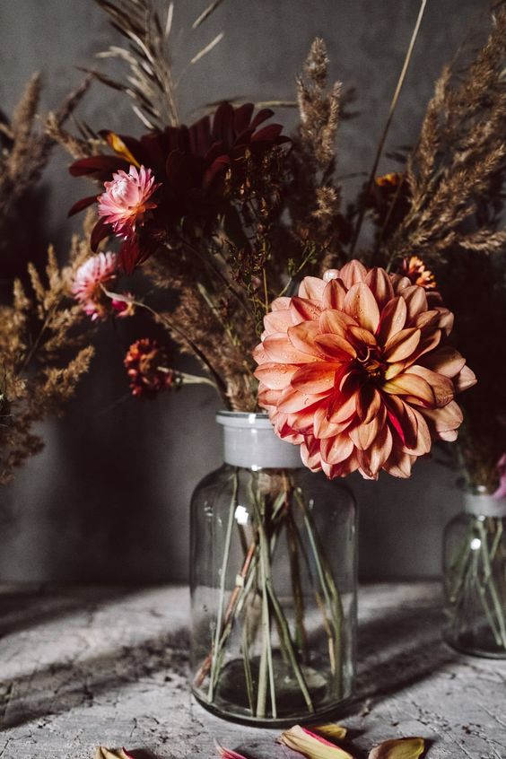 A bright and eye-catching faux and dried flower arrangement makes a cool centerpiece for fall