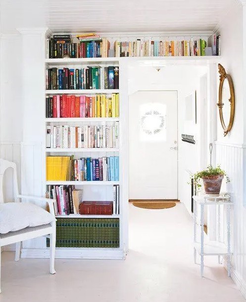 A door with open bookshelves is a nice idea to store books and add a colorful accent to the room