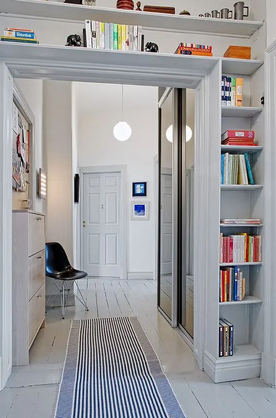 A door with open shelves covering the entire space above is a cool idea to store some things and make use of the unused space