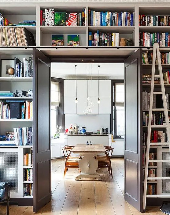 A doorway with open shelves above and around the door is like organizing an entire library around the door without wasting floor space