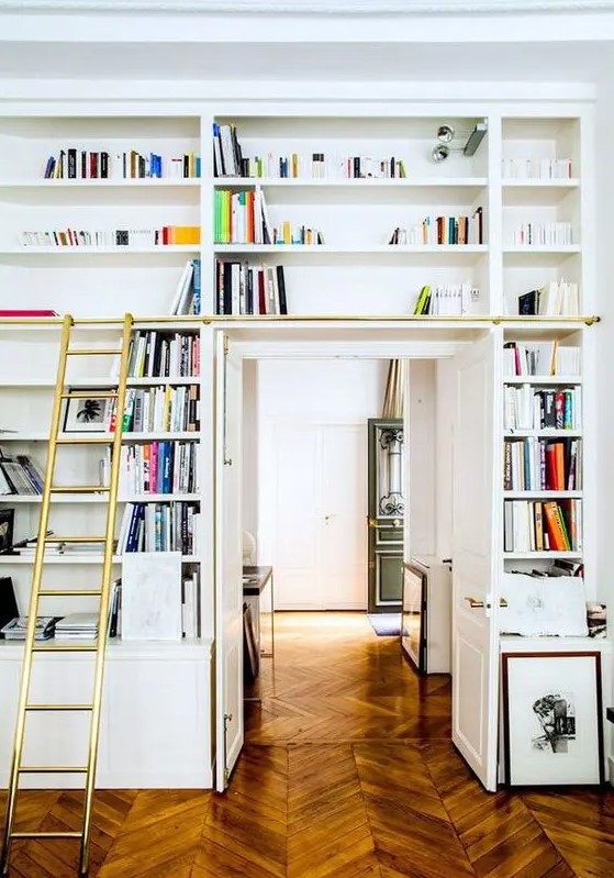 A door with open shelves and a ladder to get books out is a nice idea to create a lightweight bookshelf that doesn't take up much space