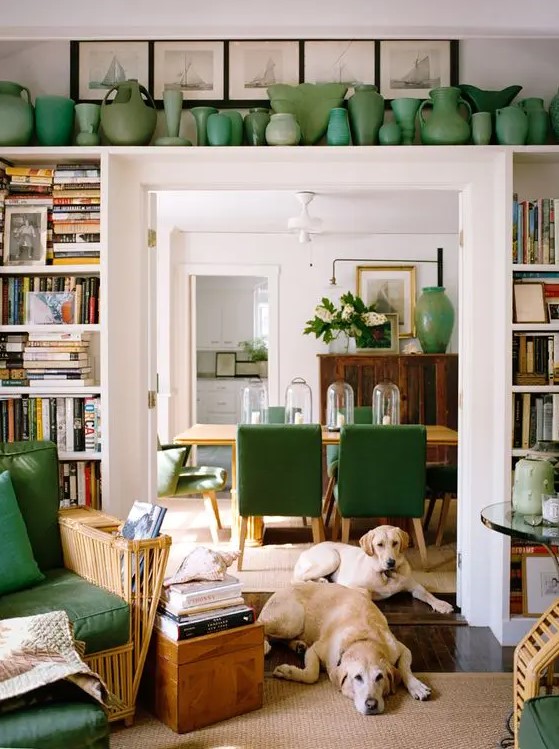 Open shelves around the door and a long shelf above are used to display vases and books. A cool idea to incorporate a touch of color and store things
