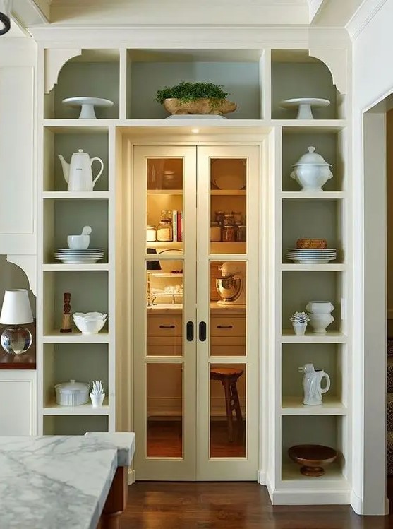 Open shelving around the door to display pretty dishes and tea sets and show off some potted plants is a super cool idea