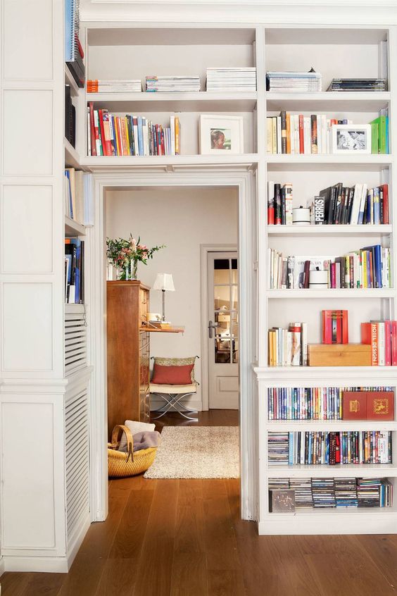 Shelves on either side of the door and above are great for storage and display, here they are used as bookcases