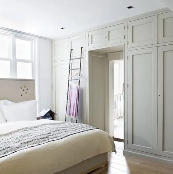 Wardrobes that take up an entire door wall are an elegant and cool storage solution for a bedroom and are great for keeping things tidy and saving space