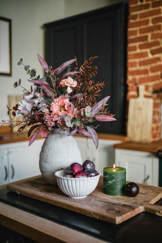 A beautiful and sophisticated artificial floral arrangement for fall in pink, lilac and blush, with eucalyptus and bold leaves
