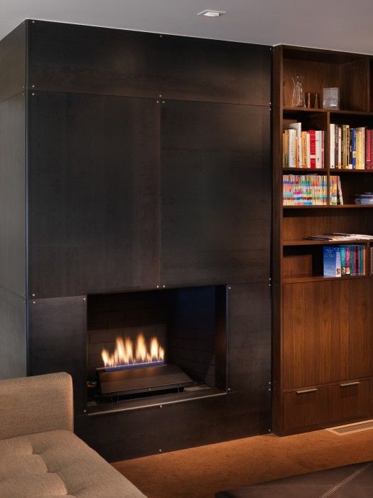 a black metal clad fireplace will make your living room stand out, it will add texture and color