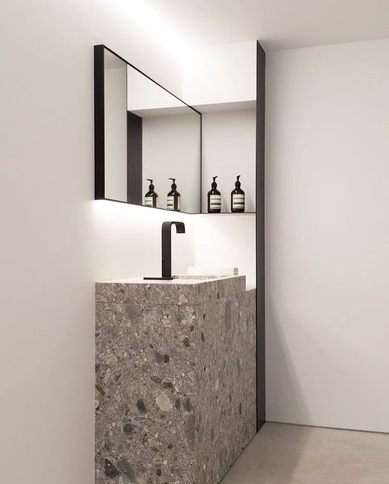 a grey and white terrazzo sink and sink stand for a minimalist bathroom with an eye-catchy look