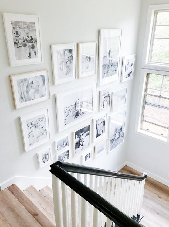 A beautiful freeform gallery wall with white, different frames is a cool and chic idea and provides coziness