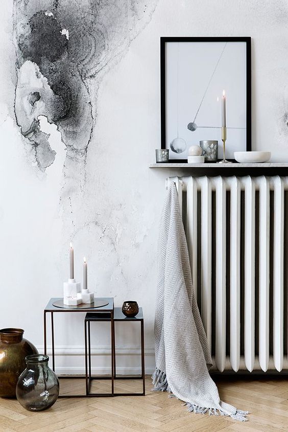 A narrow wall shelf above the radiator is a cool idea for a Scandinavian room, a clever and cool idea