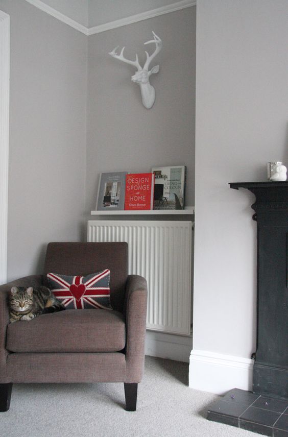 A picture rail above the radiator to store magazines and books is a clever way to make the most of this small space