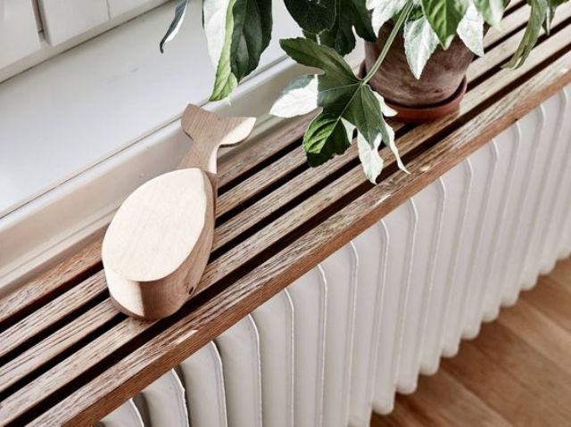A grooved plant shelf above the radiator is a super trendy and cool idea, anything grooved is very trendy at the moment