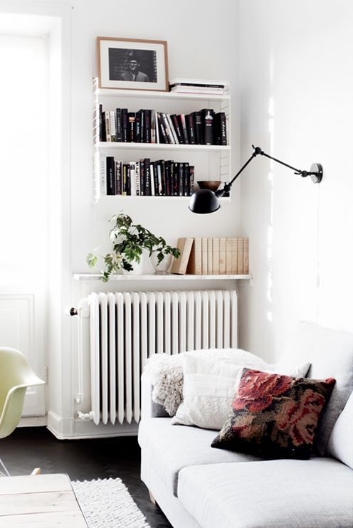 A wall shelf as an additional bookshelf, it is reflected in its design and fits harmoniously into the room