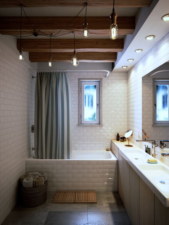 a modern bathroom with white subway tiles, wooden beams and hanging light bulbs, as well as a built-in sleek vanity with two sinks