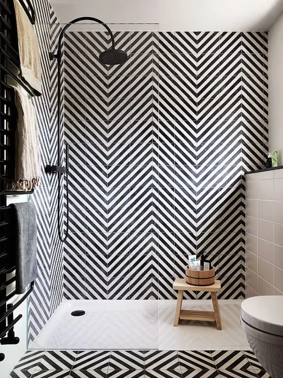 Opt for a bold look with black and white chevron tiles to impress the room