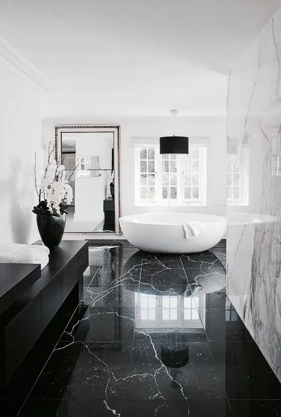 A black marble floor is a timeless solution that never goes out of style and looks stunning