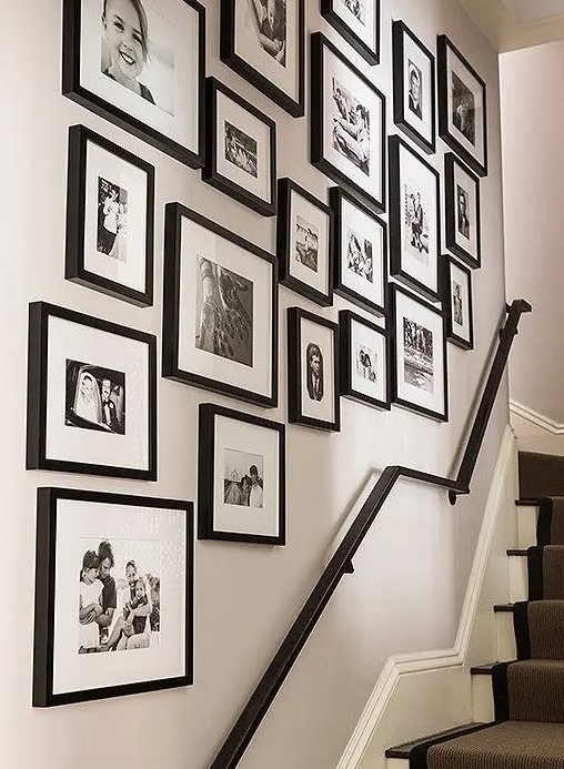 A classic freeform gallery wall in black and white with pearlescent frosting for a touch of shine and black frames is a cool idea
