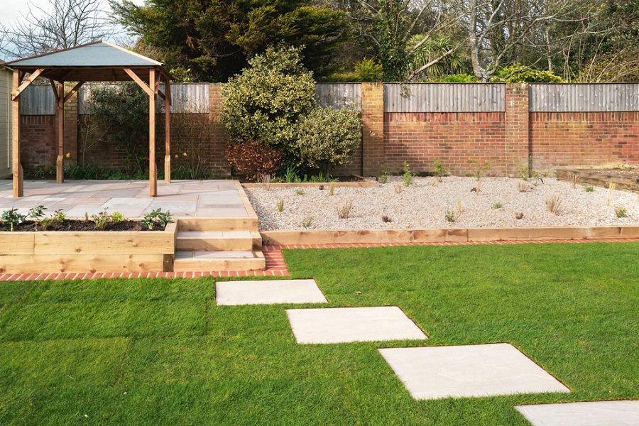 Stone paving patio and green grass