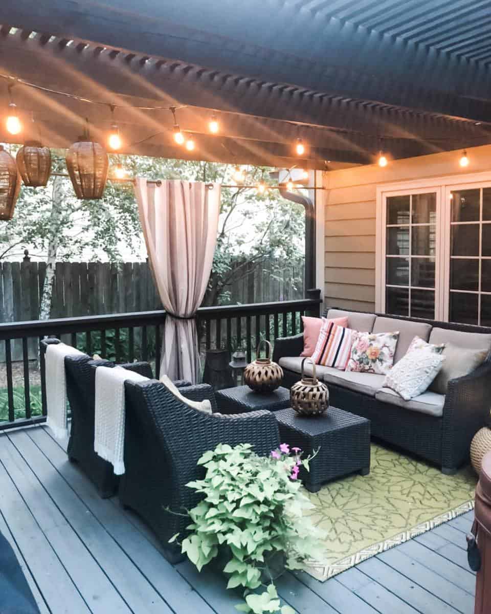 Gray wicker patio furniture string lights