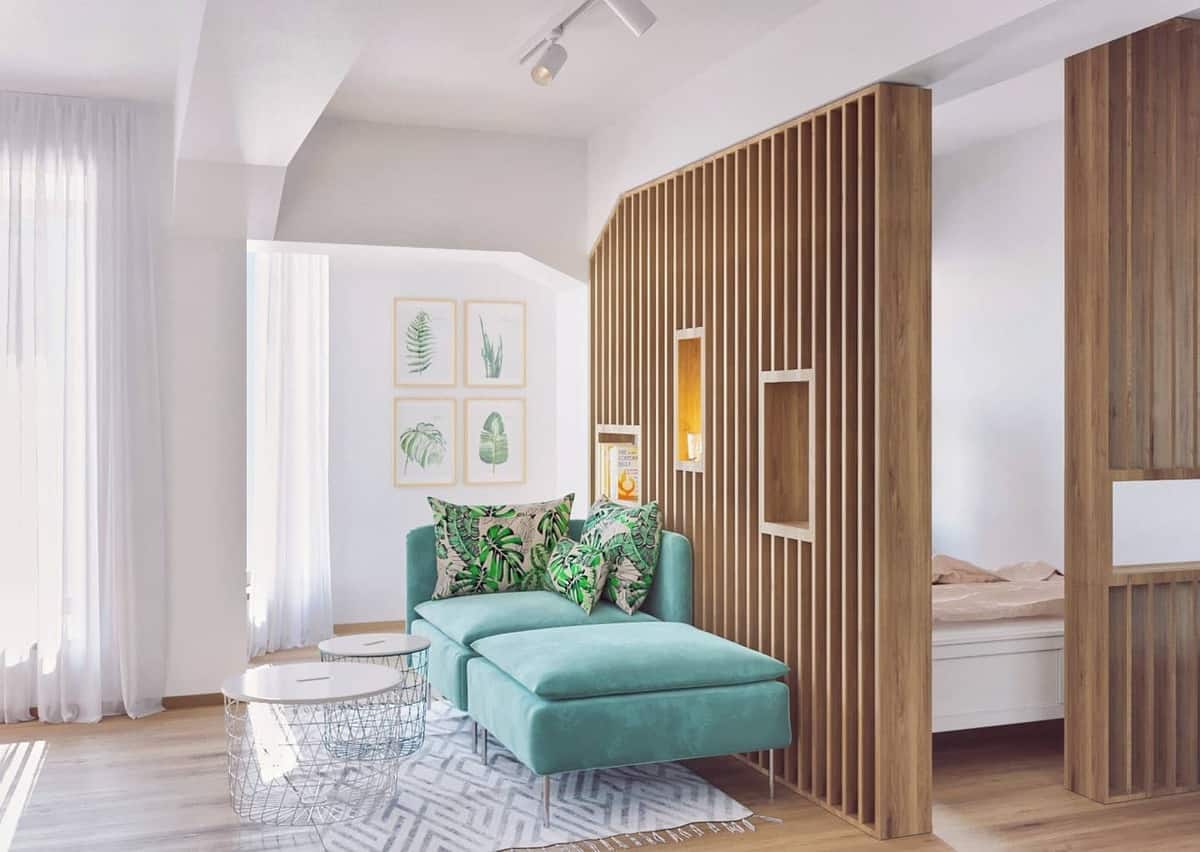 Temporary wooden partition apartment with green sofa