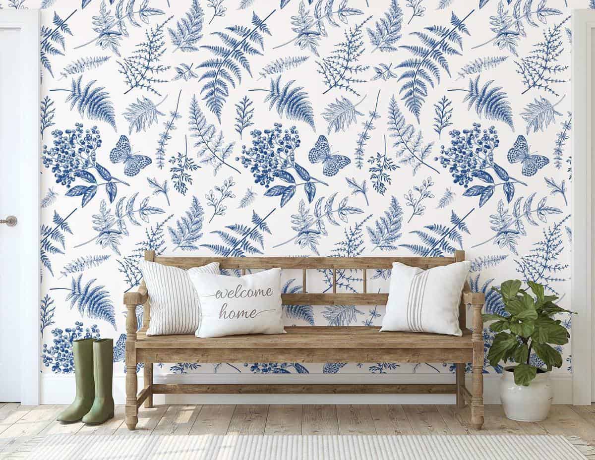 White and blue floral wallpaper, wooden bench 
