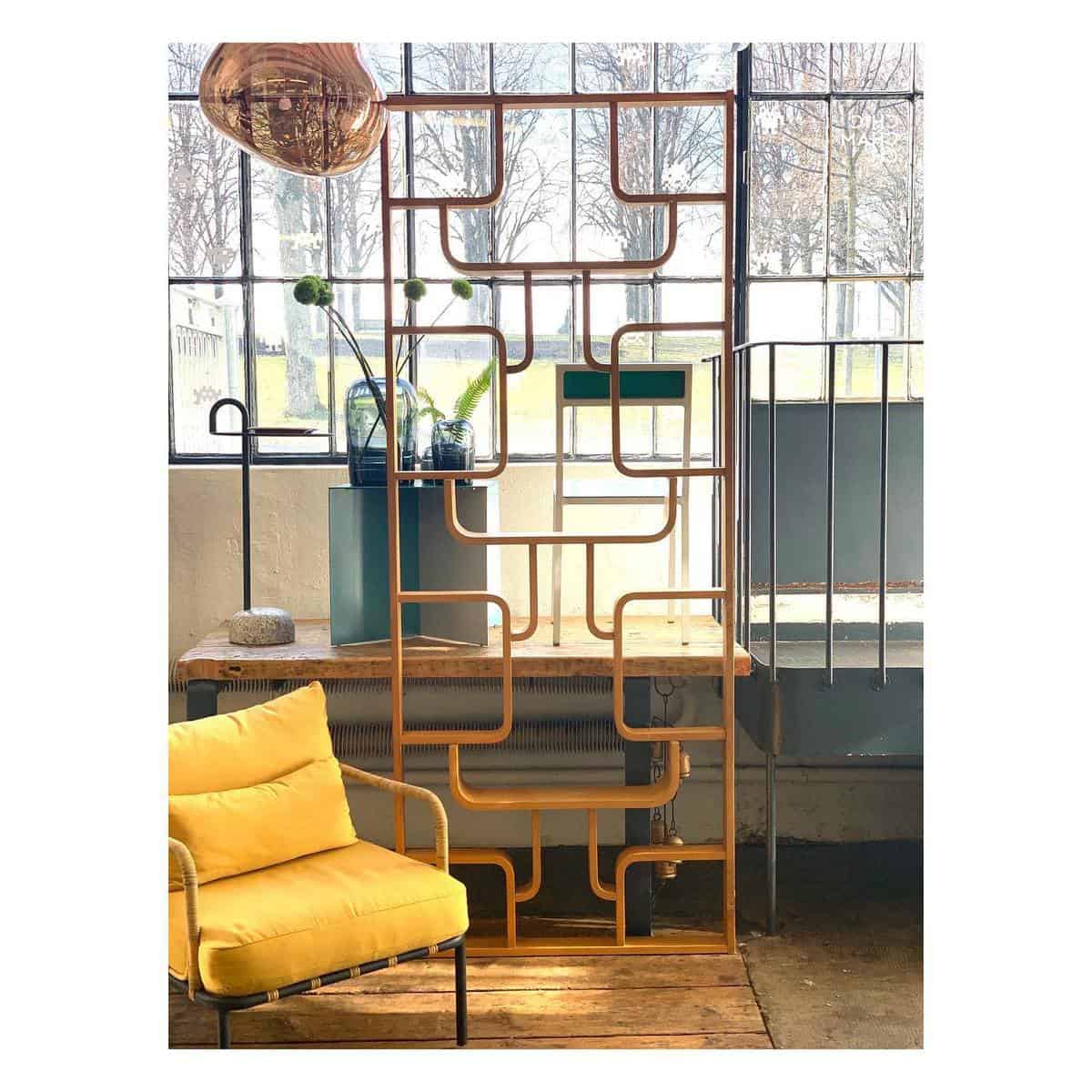 unique temporary wall divider with yellow accent chair
