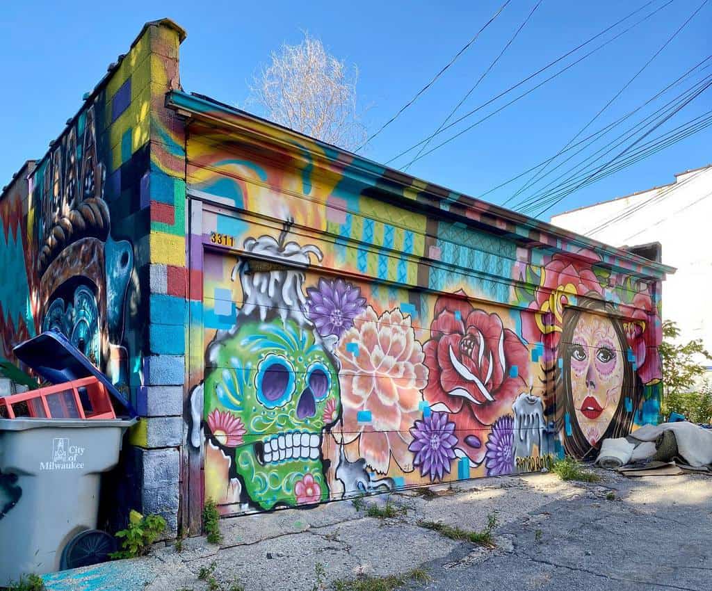 Colorful Mexican garage mural with skull and roses 