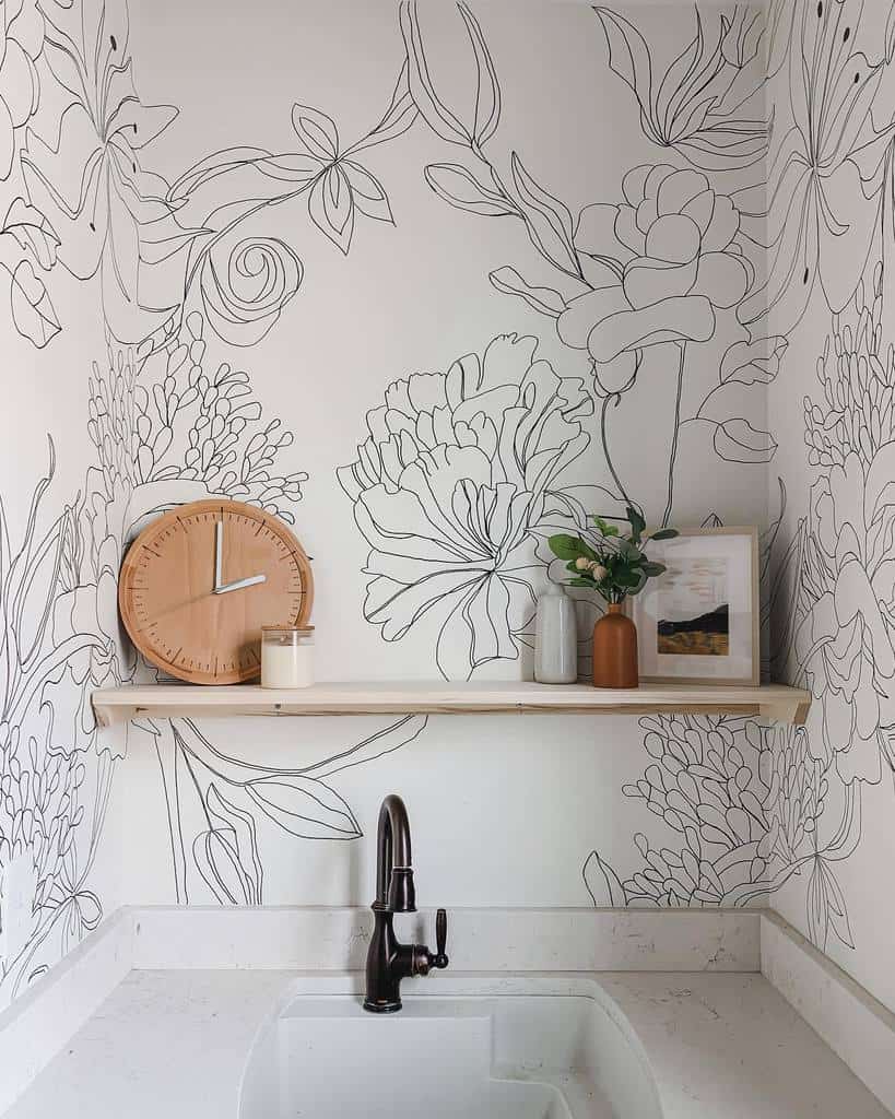 Black and white floral pattern wall mural, wooden shelf above sink 