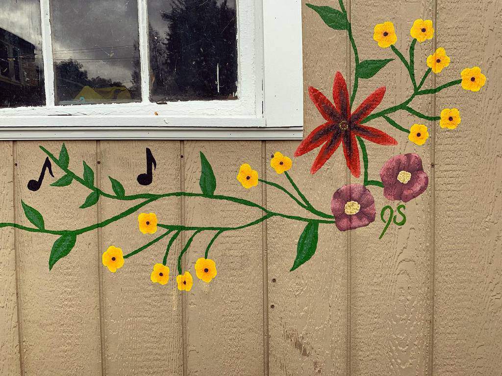 Flower mural on the outside wall of the shed 