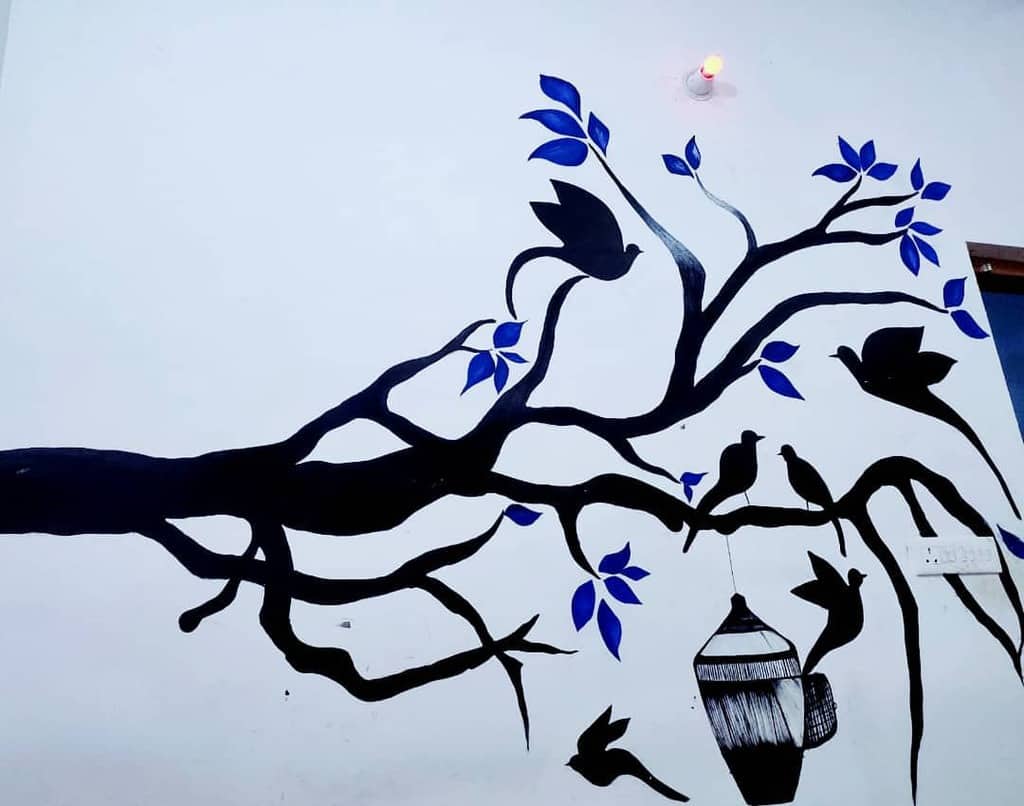 Hand painted mural with trees and birds 