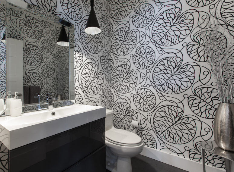 A printed black and white wallpaper is a chic and trendy idea for a bathroom or powder room