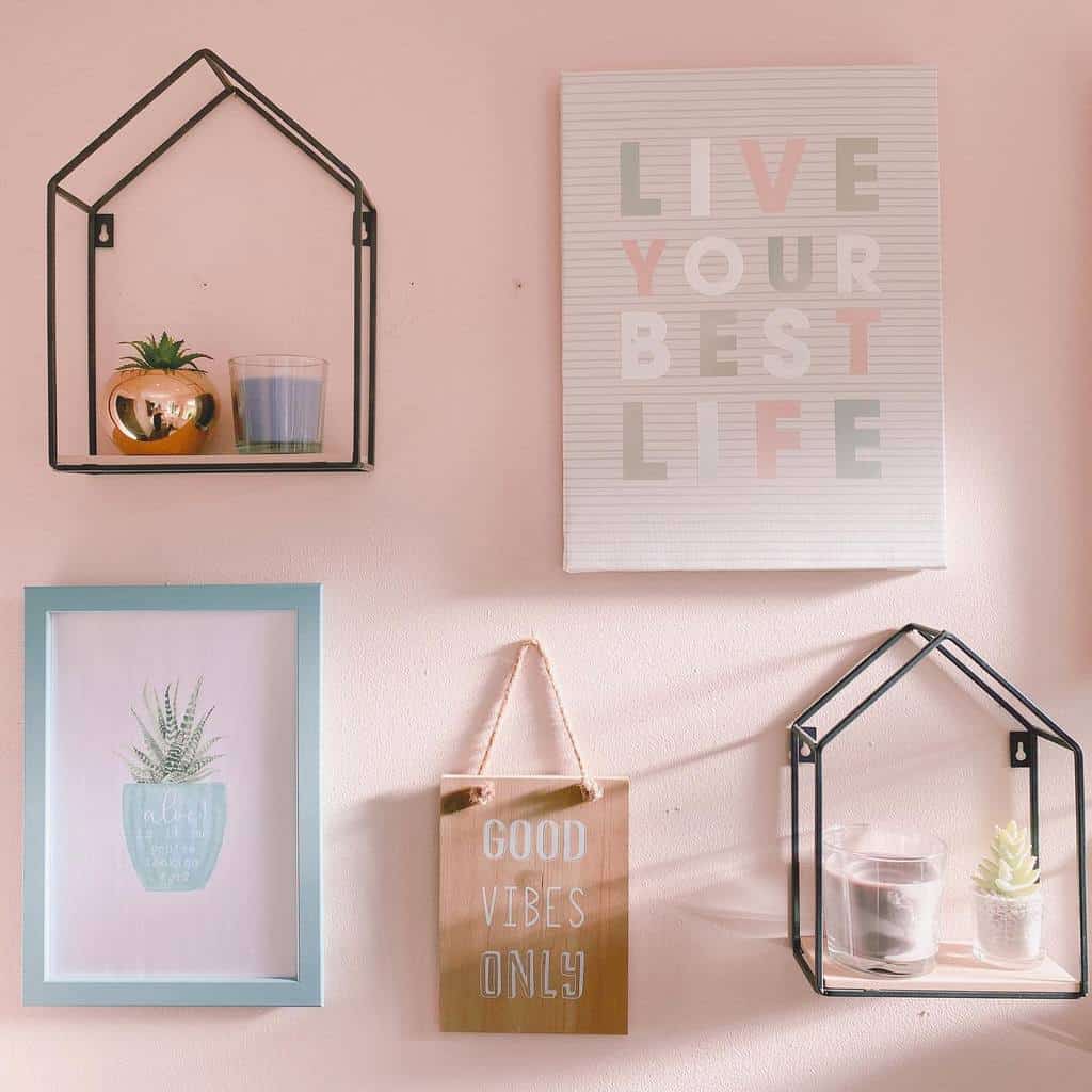 Pink bathroom wall art with frame and house shaped metal shelves 