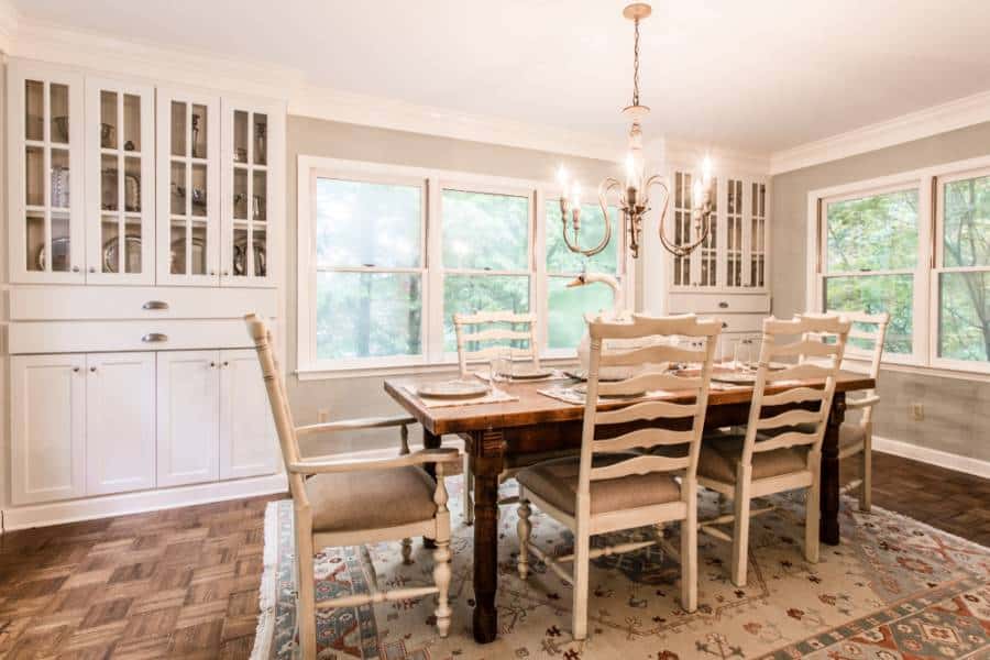 Elegant farmhouse style dining room chandelier, white cabinets