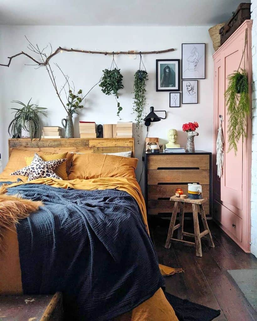 Vintage small bedroom with pink wardrobe and plants 