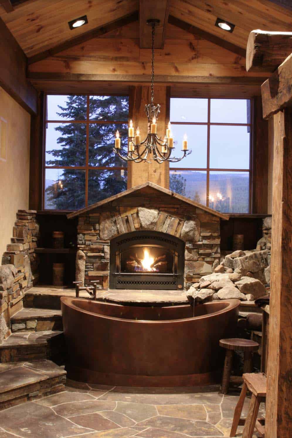 Rustic bathroom with copper tub and fireplace