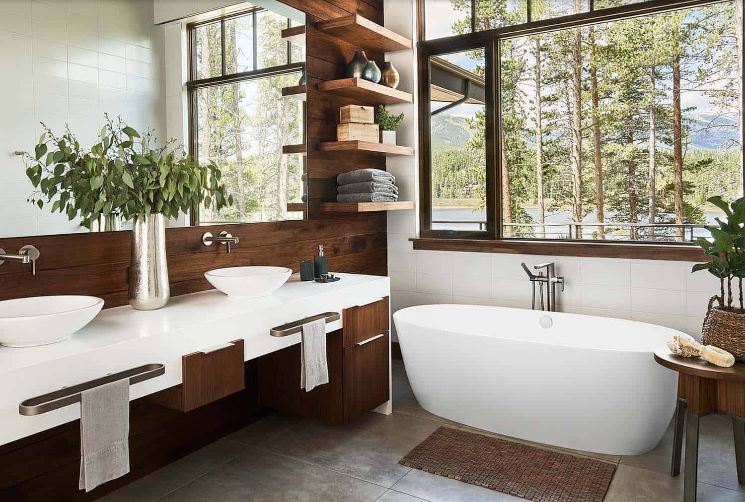 Mountain modern rustic bathroom with vanity, floating shelves and freestanding tub