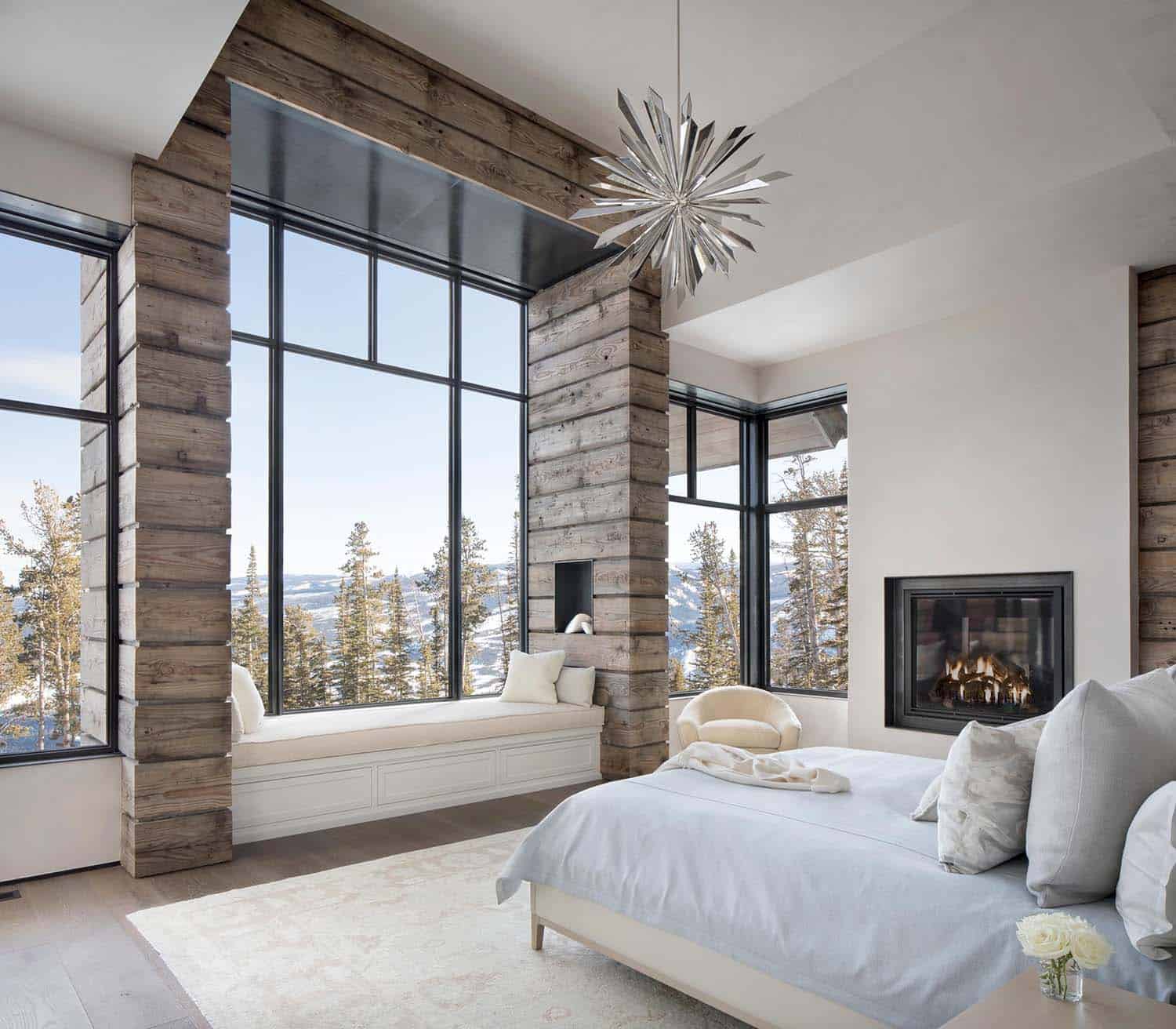 Modern ski house bedroom with window seat and view