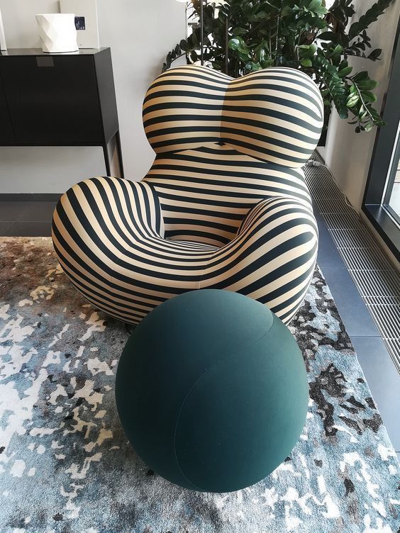 A striped sofa style chair like this one is created for ultimate relaxation and will add a touch of fun to your space