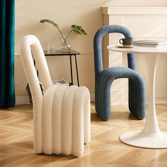 Super cool modern chairs made from curved upholstered pieces look fun and bold and add interest to the room