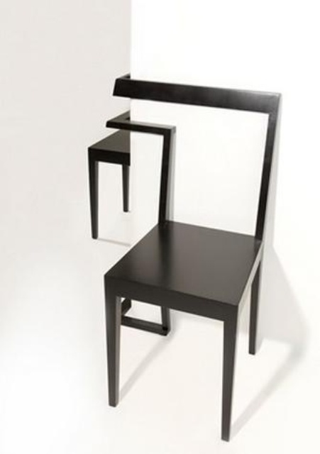 A double black corner chair with a backrest that can be placed on the corner is a cool idea for a modern room that allows you to take advantage of an awkward corner