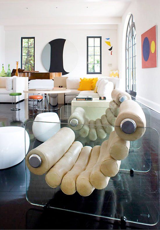 A cool modern chair with acrylic stands and cream leather is a cool idea for a modern room, this is an eye-catcher