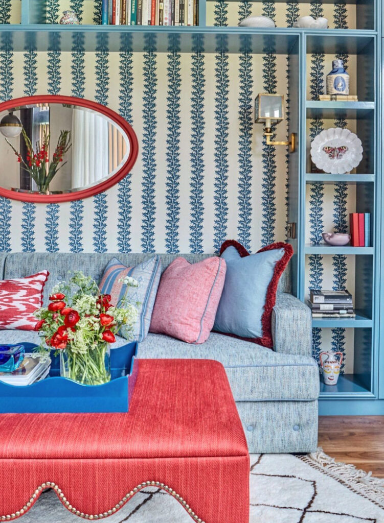 Unique blue patterned vintage wallpaper with light blue inclusions and red accents.