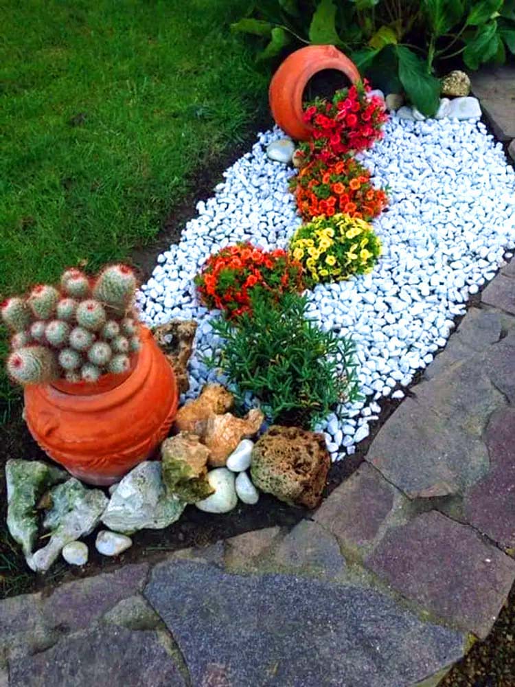 Stream of flowers on a pebble garden bed