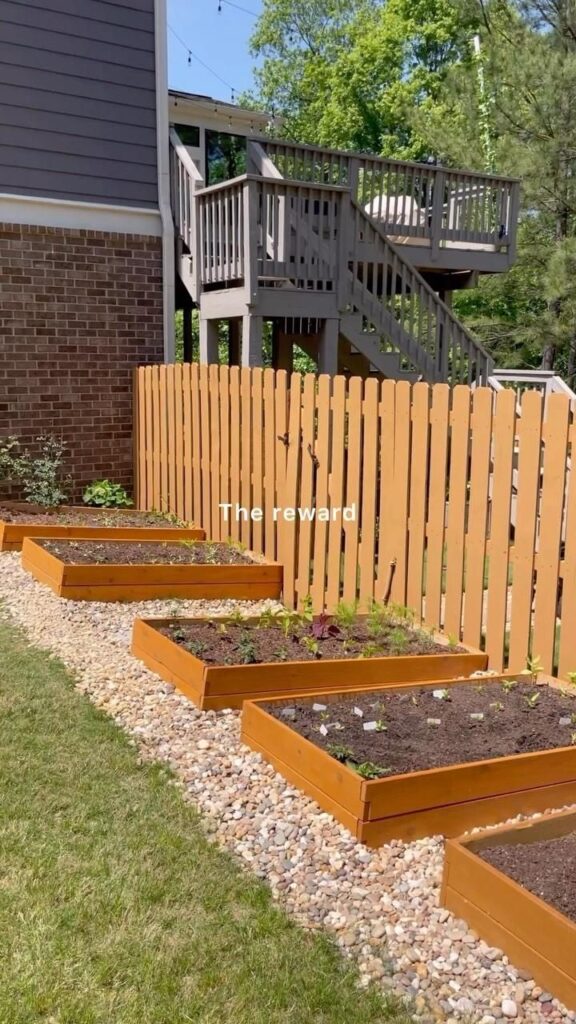 raised flower beds along fence