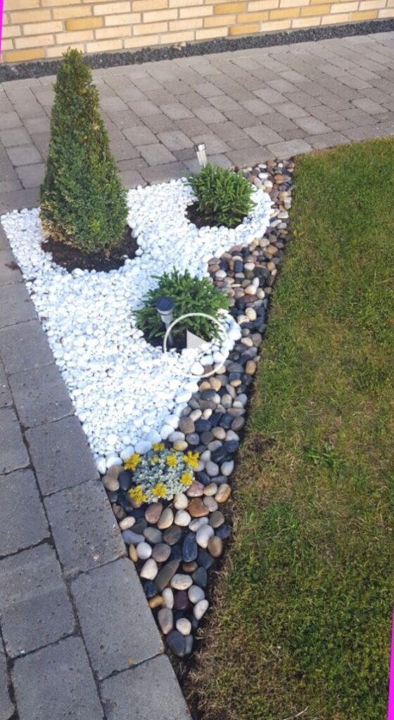 rock flower beds in front of house