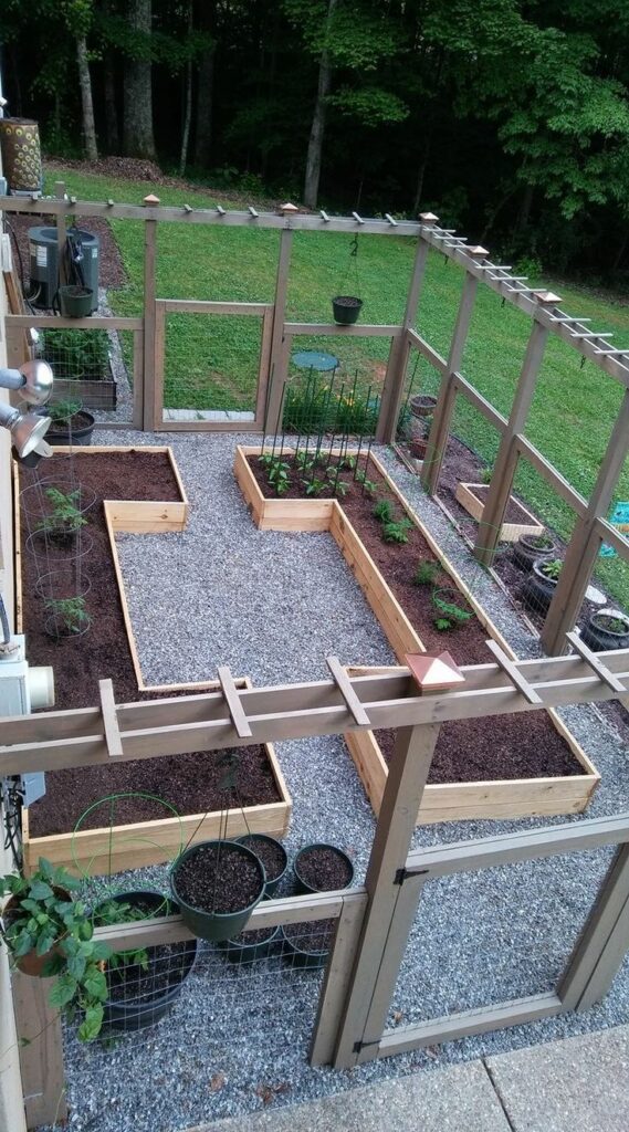 raised garden beds along fence