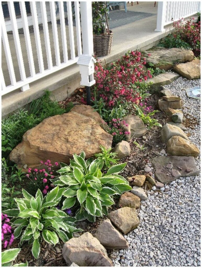 rock flower beds in front of house