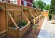 raised garden beds along fence